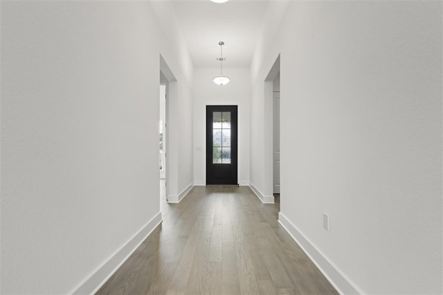 doorway to outside with hardwood / wood-style floors