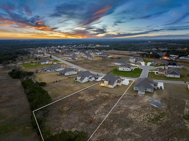 birds eye view of property with a residential view