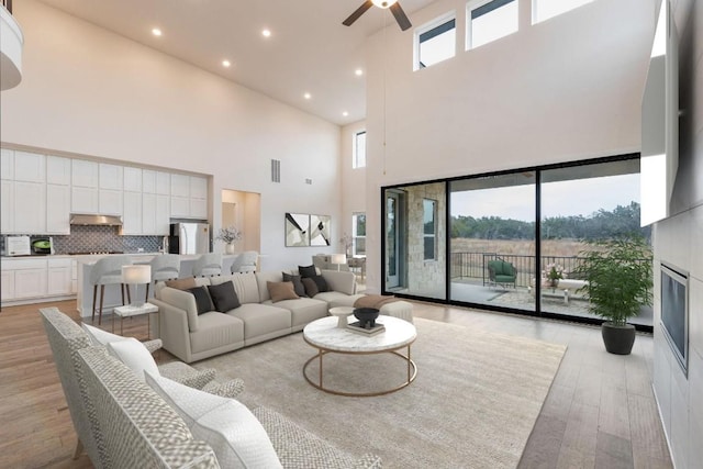 living area with visible vents, recessed lighting, a ceiling fan, and light wood-style floors