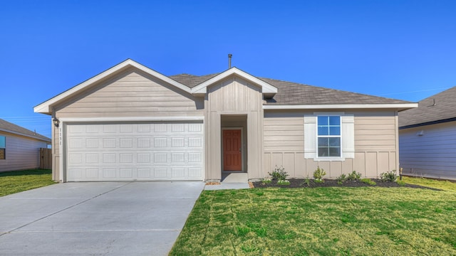 ranch-style house with a garage and a front lawn