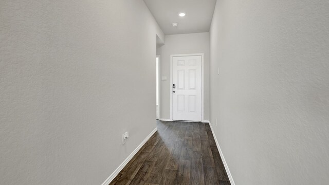 hallway featuring dark hardwood / wood-style flooring