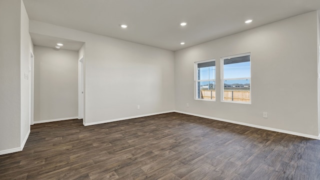 unfurnished room featuring dark hardwood / wood-style floors