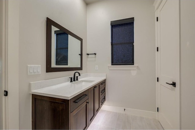 bathroom with tile patterned flooring and vanity