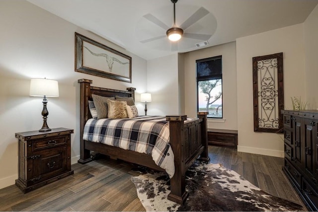 bedroom with ceiling fan and dark hardwood / wood-style flooring