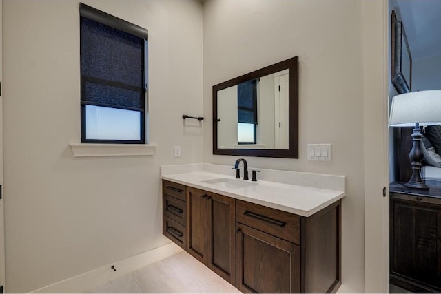 bathroom with tile patterned floors and vanity