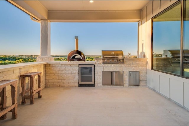 view of patio / terrace with area for grilling and sink