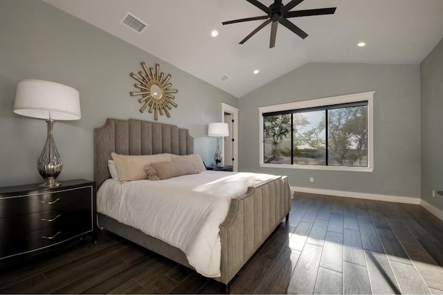 bedroom with ceiling fan, dark wood-type flooring, and vaulted ceiling