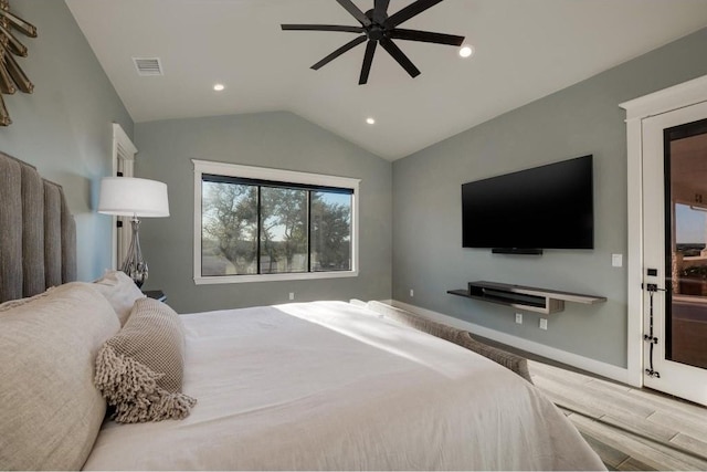 bedroom featuring ceiling fan, lofted ceiling, and light hardwood / wood-style flooring