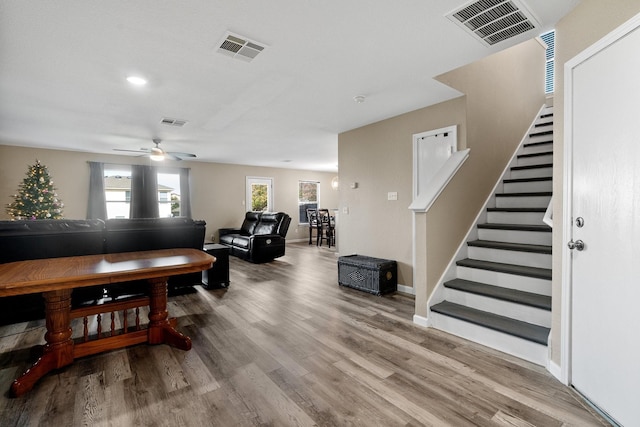 living room with ceiling fan and hardwood / wood-style flooring