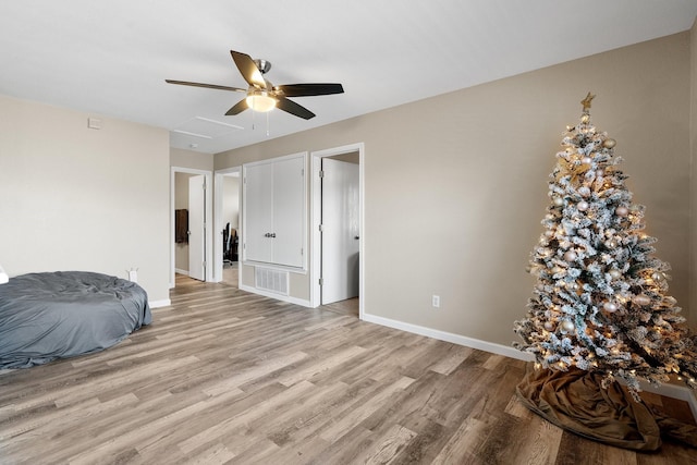 bedroom featuring ceiling fan and light hardwood / wood-style floors