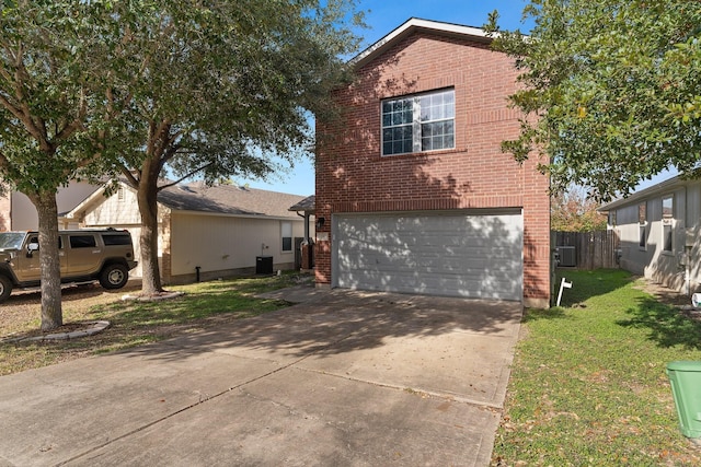 exterior space featuring a front yard, a garage, and cooling unit