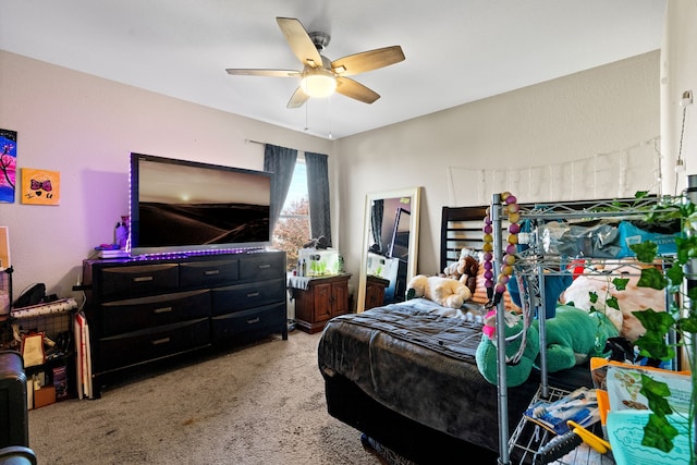 bedroom featuring light colored carpet and ceiling fan