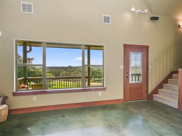 foyer entrance with high vaulted ceiling