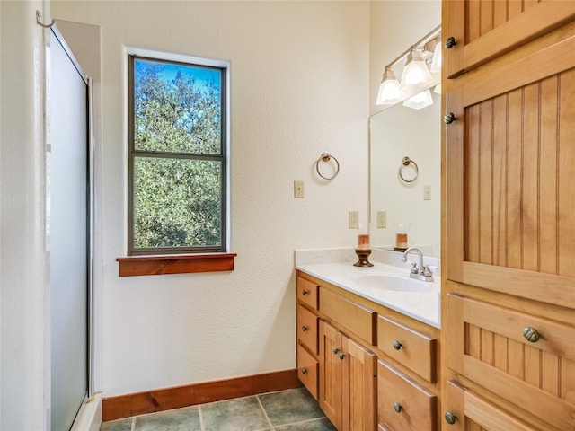 bathroom featuring tile flooring and vanity