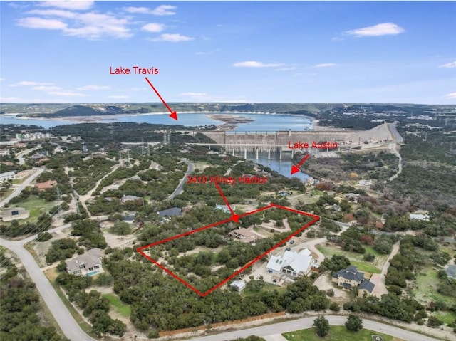 birds eye view of property featuring a water view