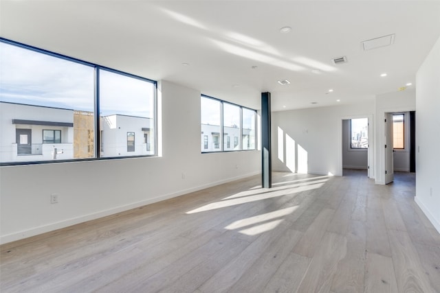 unfurnished room with light hardwood / wood-style flooring