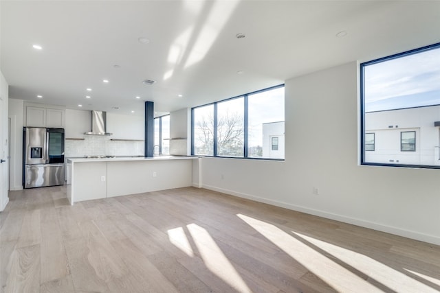 unfurnished living room featuring light hardwood / wood-style flooring