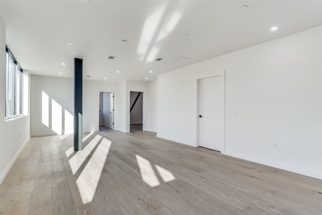 spare room featuring light hardwood / wood-style flooring