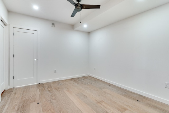 spare room with light hardwood / wood-style flooring and ceiling fan