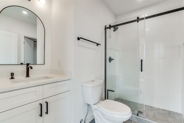 bathroom with walk in shower, toilet, and vanity