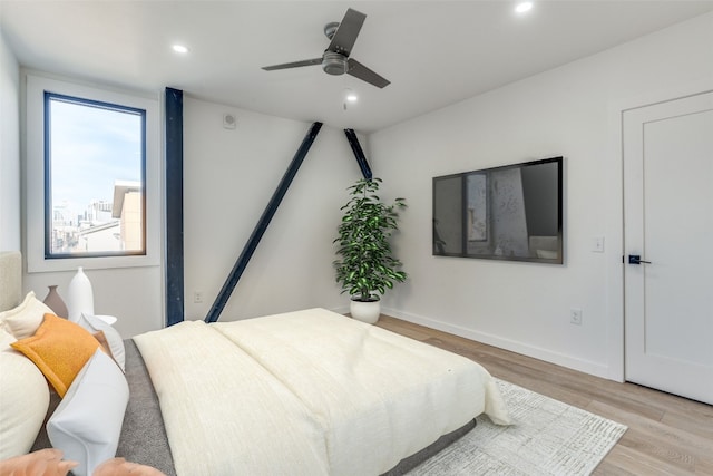 bedroom featuring light hardwood / wood-style flooring and ceiling fan