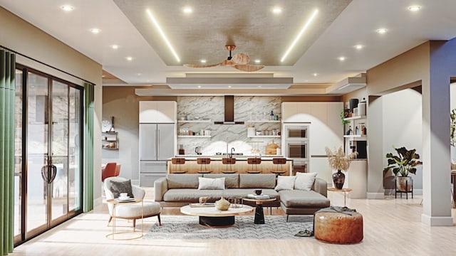 living room featuring a raised ceiling