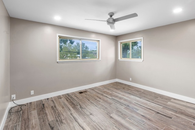 spare room featuring ceiling fan and wood-type flooring