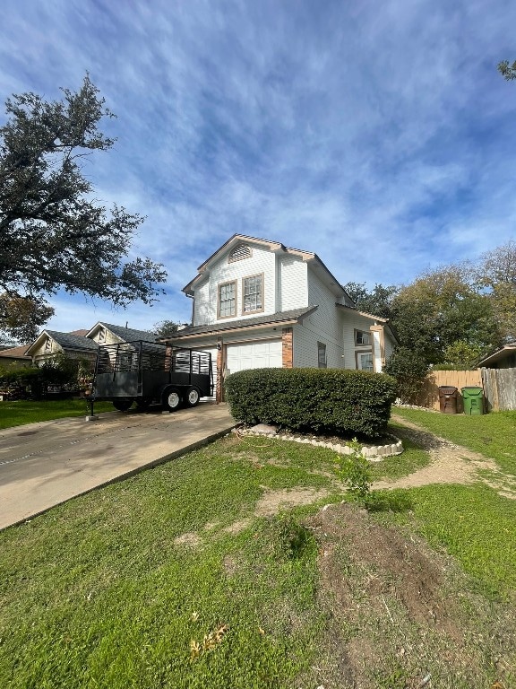 view of side of home with a yard and a carport