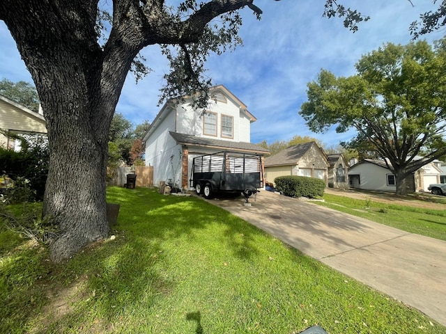 view of front of property with a garage and a front yard