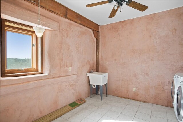 interior space with ceiling fan, washer / dryer, and light tile patterned floors