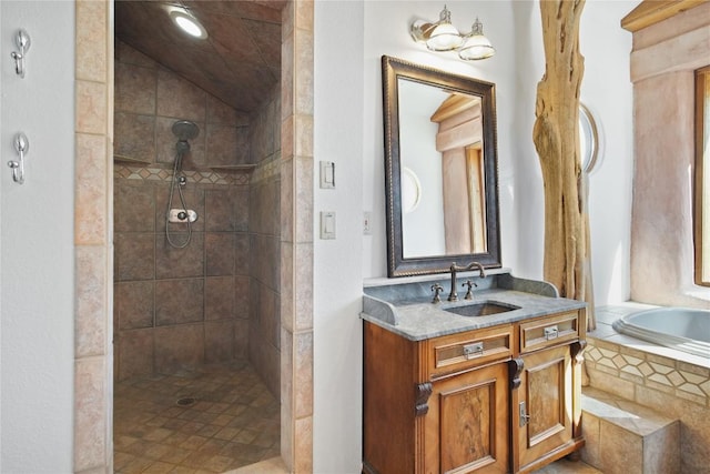 bathroom featuring separate shower and tub and vanity