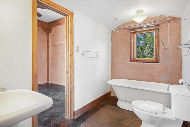 full bathroom featuring vaulted ceiling, sink, tile patterned floors, toilet, and separate shower and tub