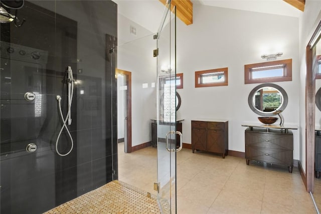 bathroom with beam ceiling, tile patterned floors, high vaulted ceiling, and walk in shower