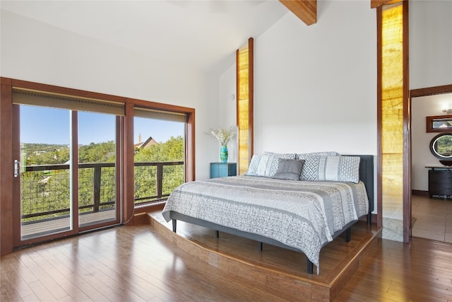 bedroom featuring high vaulted ceiling, beamed ceiling, and wood-type flooring