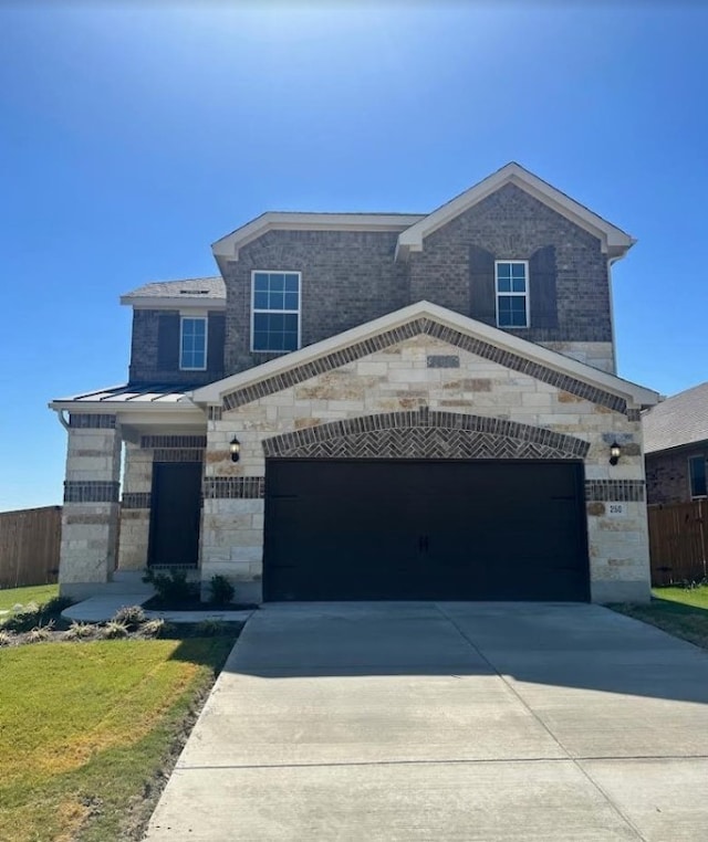 view of front facade with a front lawn and a garage