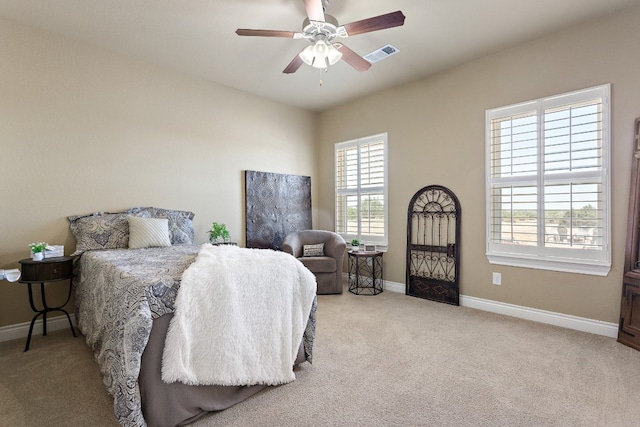 bedroom featuring a ceiling fan, carpet, visible vents, and baseboards