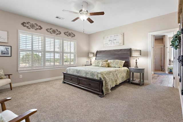 bedroom with carpet floors, baseboards, visible vents, and ceiling fan