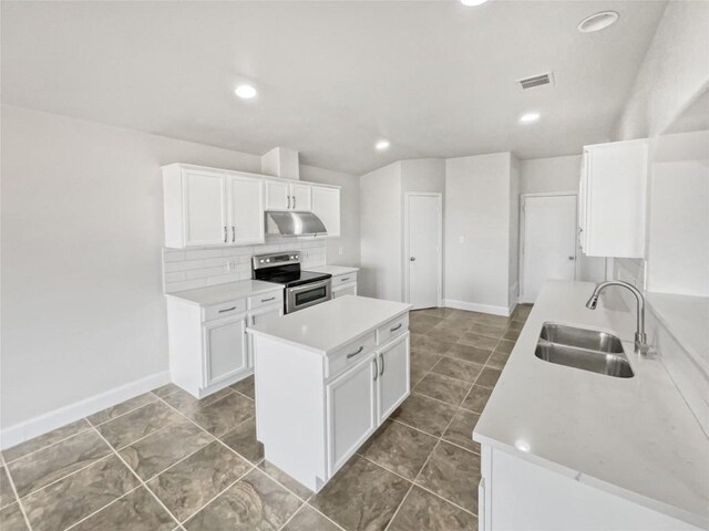 kitchen with white cabinetry, sink, backsplash, and stainless steel range with electric cooktop