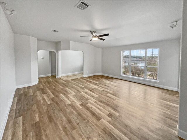 unfurnished living room with light hardwood / wood-style floors and ceiling fan