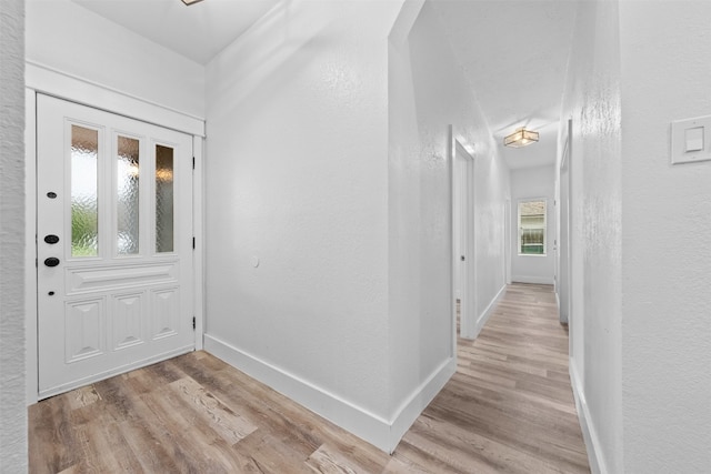 foyer entrance with light wood-type flooring