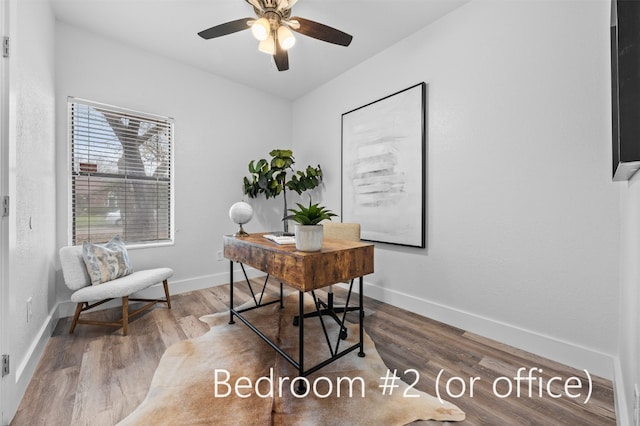 home office featuring ceiling fan and hardwood / wood-style flooring