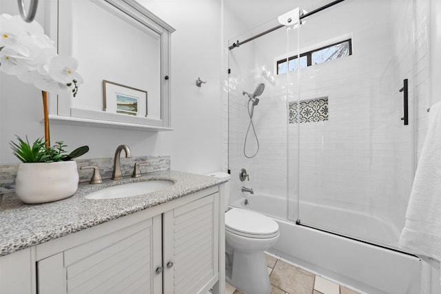 full bathroom with vanity, toilet, shower / bath combination with glass door, and tile patterned floors