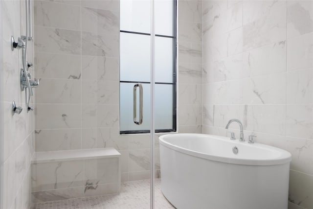 bathroom with plus walk in shower and tile walls