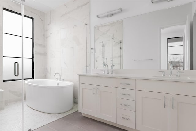 bathroom featuring independent shower and bath, tile patterned flooring, tile walls, and vanity