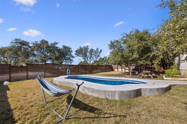 view of pool featuring a yard