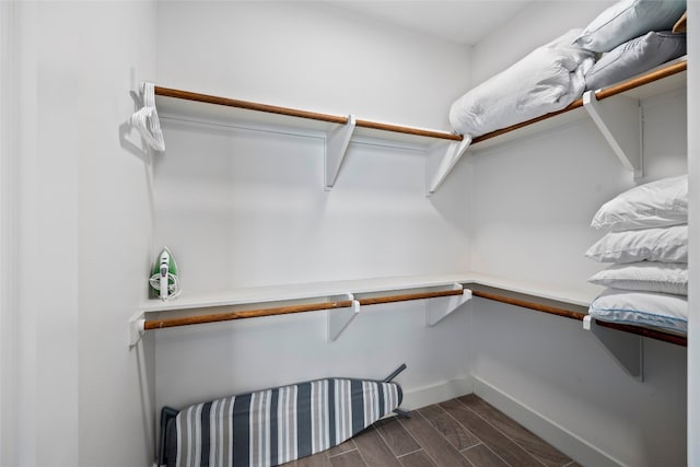 walk in closet featuring dark hardwood / wood-style floors