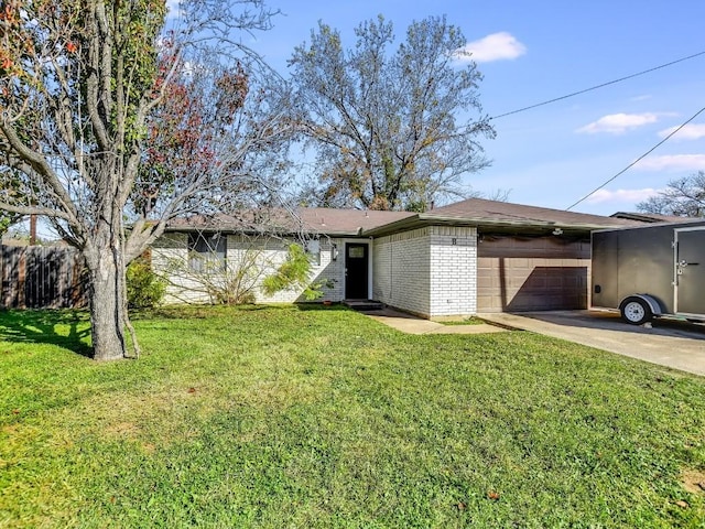 view of front facade with a garage and a front yard