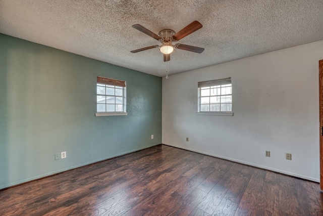 unfurnished room with ceiling fan, dark hardwood / wood-style floors, and a textured ceiling