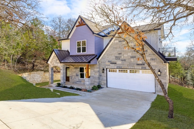 view of front of house with a garage and a front lawn