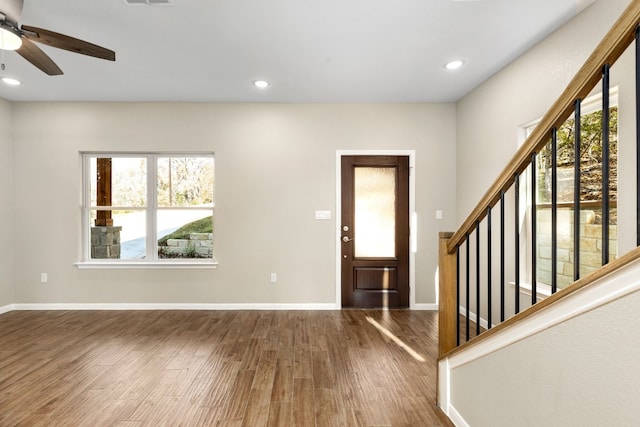 entryway with hardwood / wood-style floors and ceiling fan